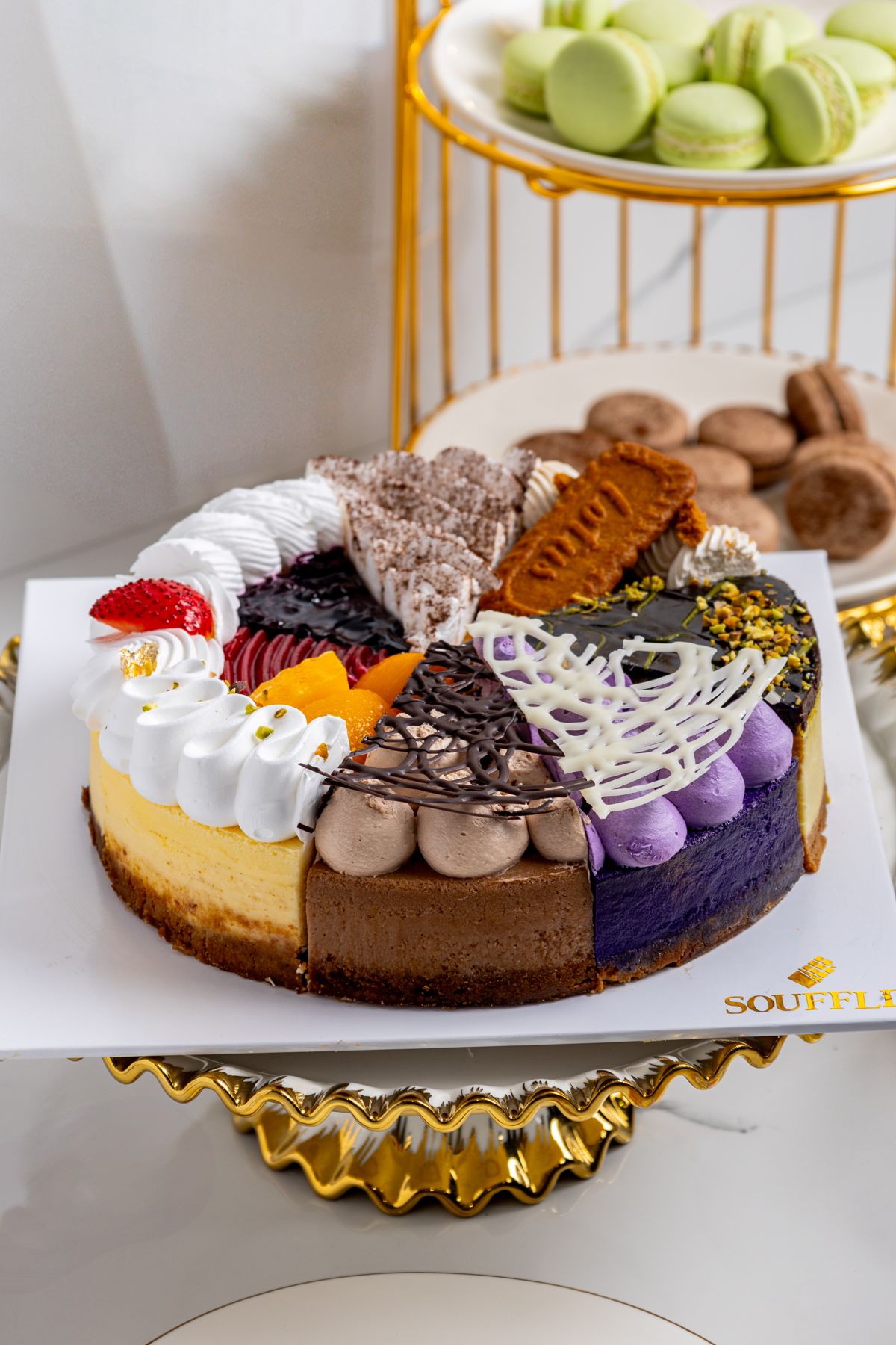 Signature Souffle cakes on gold stands